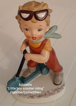 Little Boy Scooter Riding Figurine